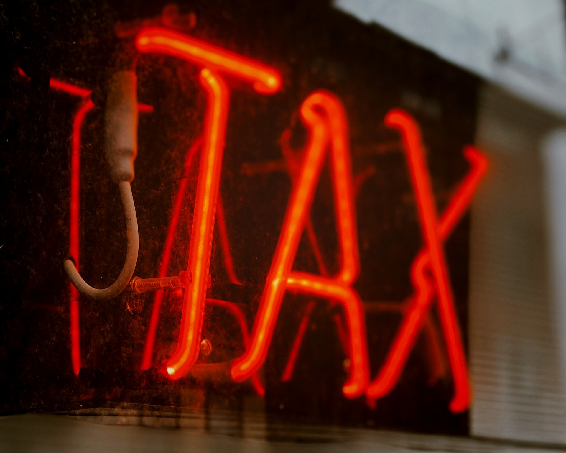 Neon sign that says TAX