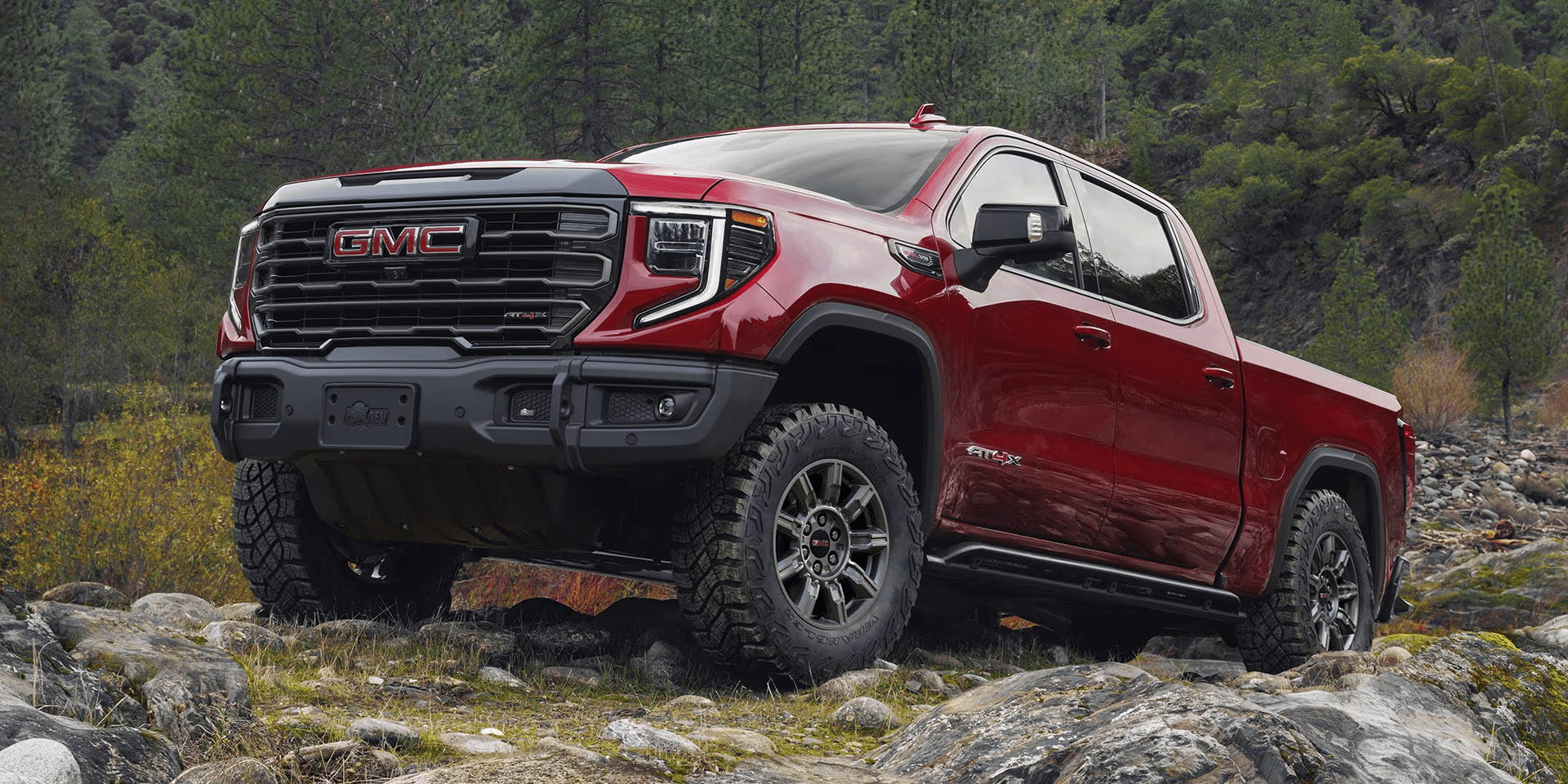 2025 GMC Sierra 1500 driving on rocks